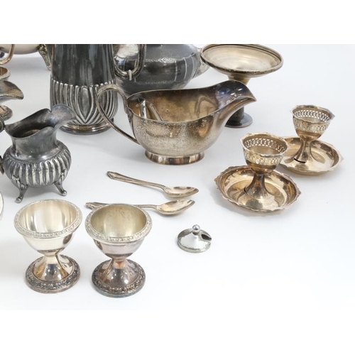 675 - A quantity of assorted silver plated wares to include part tea sets, vases etc