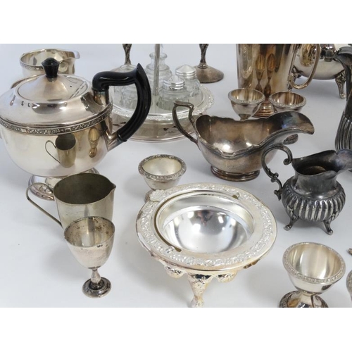 675 - A quantity of assorted silver plated wares to include part tea sets, vases etc