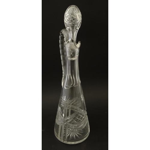 692 - A tall cut glass claret jug together with an onion shaped glass decanter with facet cut decoration. ... 