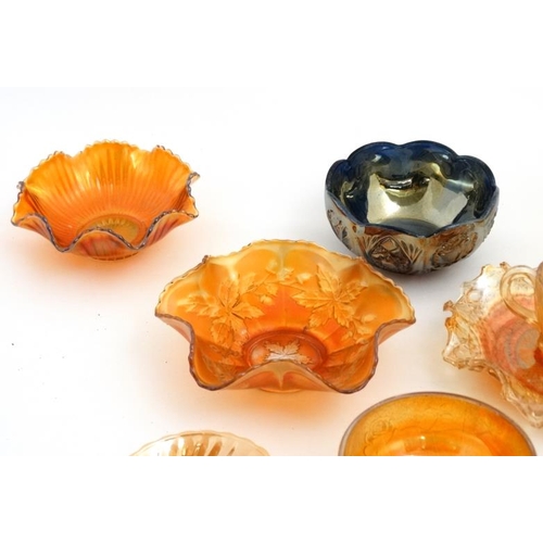 694 - A large quantity of assorted Carnival glass to include bowls, jugs etc