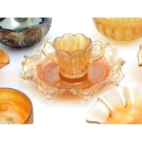 694 - A large quantity of assorted Carnival glass to include bowls, jugs etc