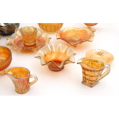 694 - A large quantity of assorted Carnival glass to include bowls, jugs etc