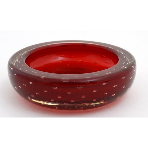 696 - Retro glass : A Whitefriars style red glass bowl with air bubble inclusions,. 6'' diameter