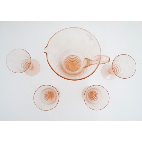 699 - Art Deco : a peach glass lemonade jug with four  matching glasses. The jug 9 1/2'' high