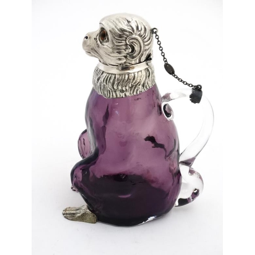 700 - A 21stC novelty claret jug/ water jug formed as a monkey with amethyst glass body and silver plated ... 