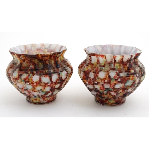 705 - A pair of small glass pots, the milk glass interiors with end of the day style overlay 2 1/2'' high