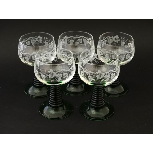 711 - 5 mid-late 20thC wine glasses with fruiting vine decoration to bowl and green stem and foot. Marked ... 