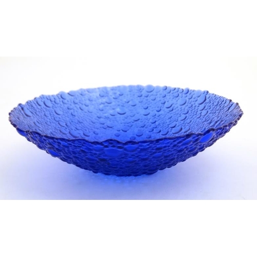 715 - An art glass blue glass bowl with textured finish 8'' diameter