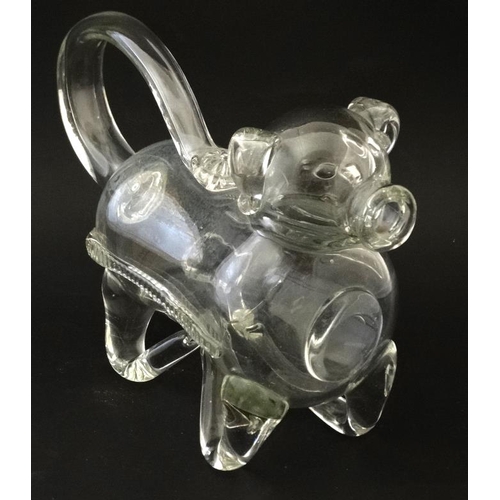 721 - An early 20thC novelty glass claret jug / decanter in the form of a dog  approx 10 1/2'' long