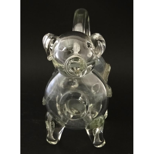 721 - An early 20thC novelty glass claret jug / decanter in the form of a dog  approx 10 1/2'' long