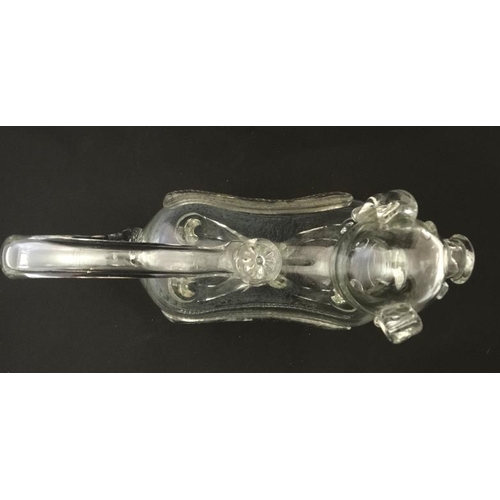 721 - An early 20thC novelty glass claret jug / decanter in the form of a dog  approx 10 1/2'' long