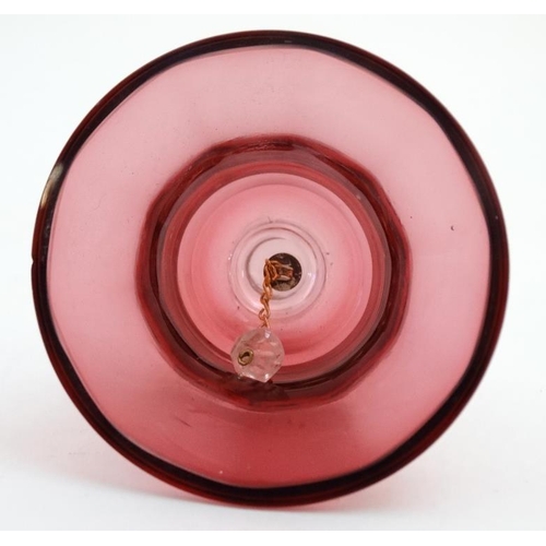 722 - Cranberry Glass : a quantity of glass wares including  2 jugs, bell and a caster. Tallest 6''