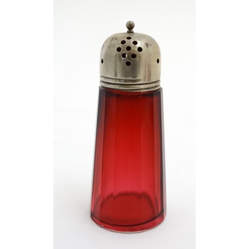 722 - Cranberry Glass : a quantity of glass wares including  2 jugs, bell and a caster. Tallest 6''