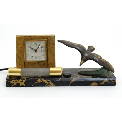 73 - Art Deco bedside light and clock : a French marble base with swooping sea bird and wind up clock hav... 