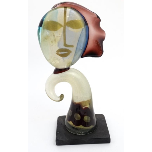 735 - Art Glass: An 20thC art glass sculpture of a stylised female head , Probably Murano . The whole 18 1... 