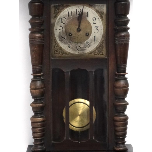 74 - Clock : an early 20 thC Walnut cased 8 day Wall clock with sprung movement striking on a gong, the w... 