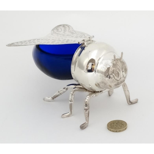 742 - A late 20thC / early 21stC novelty honey pot formed as a bee with blue glass body and silver plated ... 