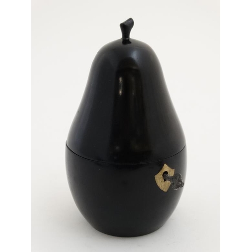 752 - Kitchenalia : A late 20thC / early 21stC novelty tea caddy formed as a pear with ebonised finish. Ap... 