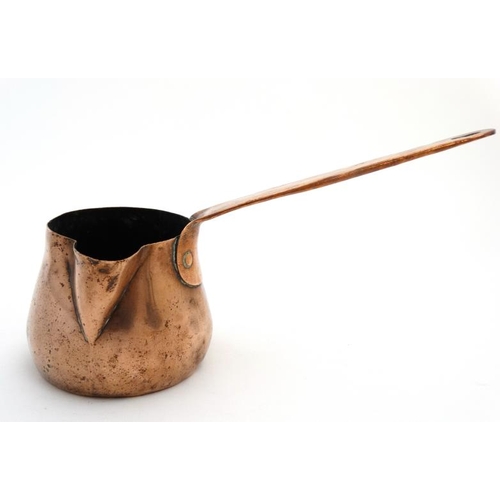 753 - A small 19thC Copper milk pan with handle to one side and spout to front. 12'' long.