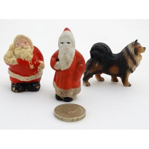 759 - Three vintage cake decorations to include two c1950s Christmas painted plaster Santa Claus cake topp... 