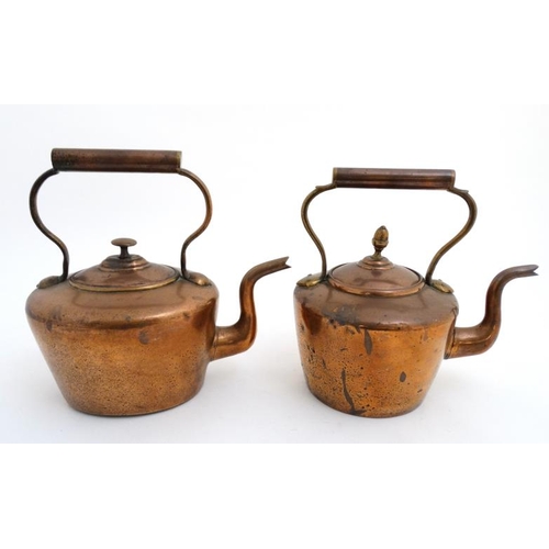 762 - 2 copper kettles, one with an acorn formed finial to lid. The tallest approx 12'' high