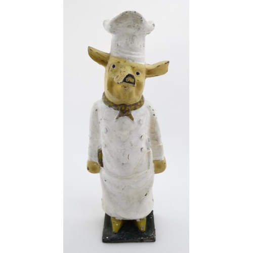 769 - A shop display model of a polychrome painted cast iron model of a comical pig in chefs whites 24'' h... 