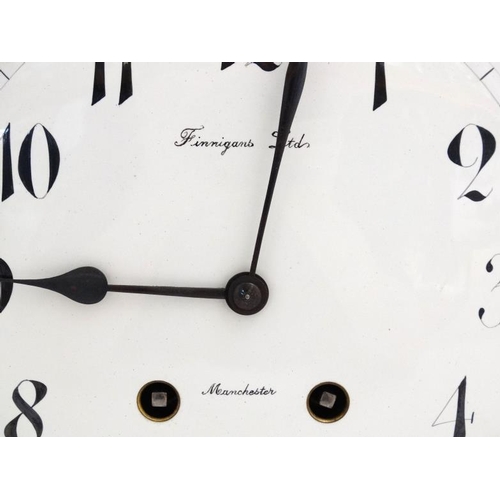 77 - Finnegans Ltd Manchester : an 8 day bracket Clock striking on a coiled gong in a Mahogany stained oa... 