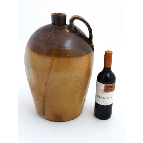 772 - A 19thC staltglazed 2-tone bullet shaped flagon with loop handle. Approx 16'' high