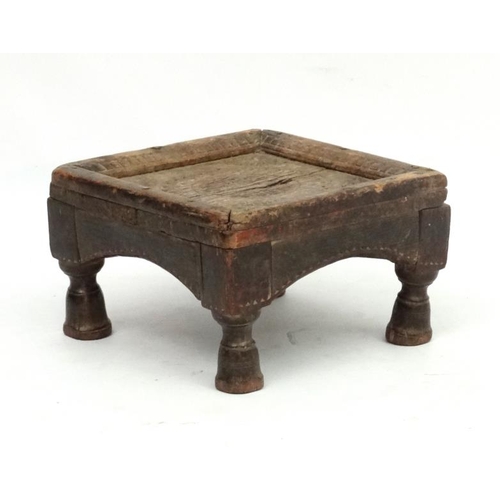 779 - Ethnographic Native Tribal :   A carved wooden footstool with chip like carved decoration,6 1/2'' hi... 