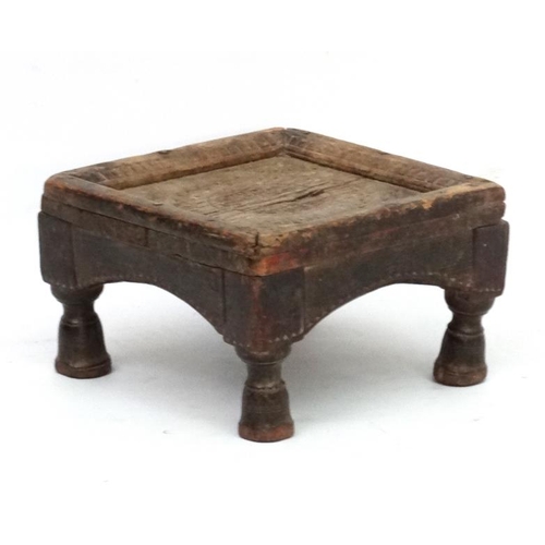 779 - Ethnographic Native Tribal :   A carved wooden footstool with chip like carved decoration,6 1/2'' hi... 