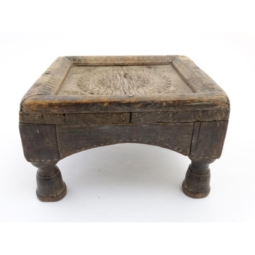 779 - Ethnographic Native Tribal :   A carved wooden footstool with chip like carved decoration,6 1/2'' hi... 