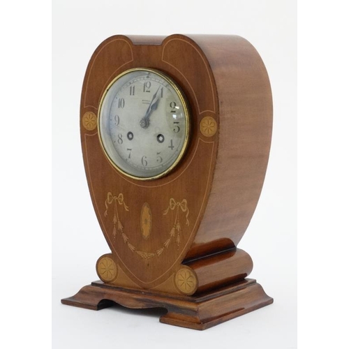 78 - Rowell Oxford : a signed Art Nouveau shaped case inlaid mahogany mantle clock, striking on a coiled ... 