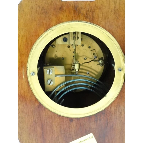 78 - Rowell Oxford : a signed Art Nouveau shaped case inlaid mahogany mantle clock, striking on a coiled ... 