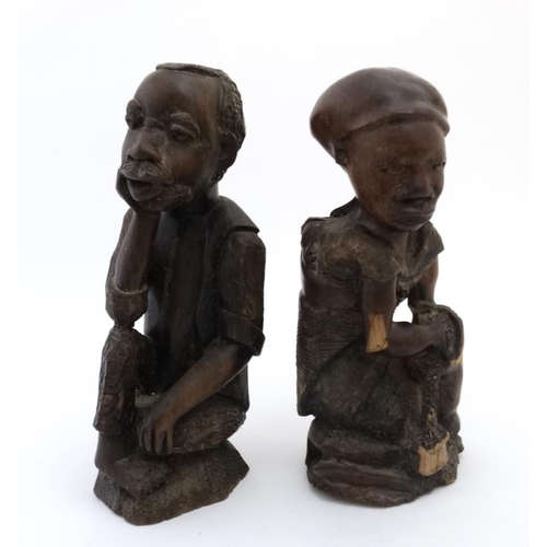 784 - Ethnographic Native Tribal :   A pair of carved hardwood African  figures , the male contemplating a... 