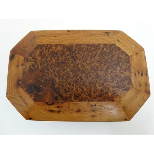 799 - A 20thC walnut box of octagonal form with burr wood decoration . 5 1/4'' x 8'' x 2 1/4''