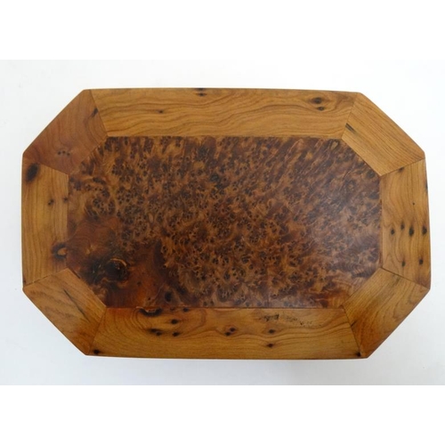 799 - A 20thC walnut box of octagonal form with burr wood decoration . 5 1/4'' x 8'' x 2 1/4''