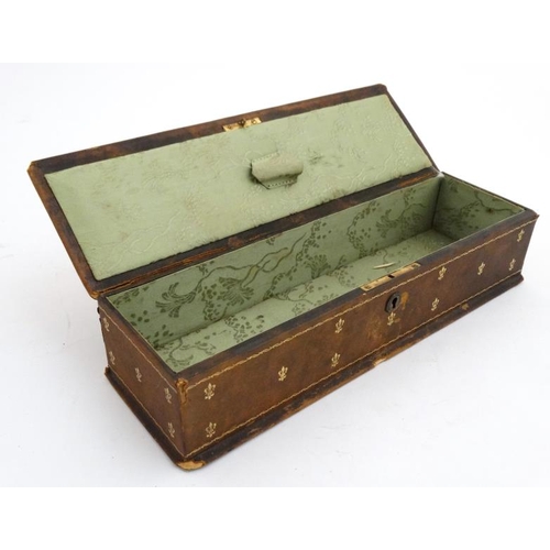 806 - A La Toilette Pont Des Marechaux : A French gold tooled leather glove box opening to reveal silk int... 