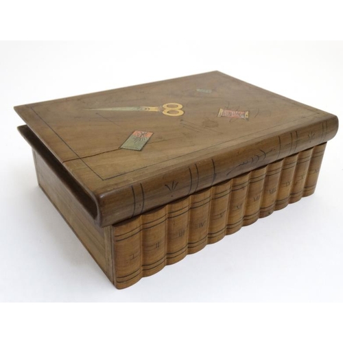 807 - An olive wood book form needlework box with inlaid needles, thimble scissor pine decoration and puzz... 