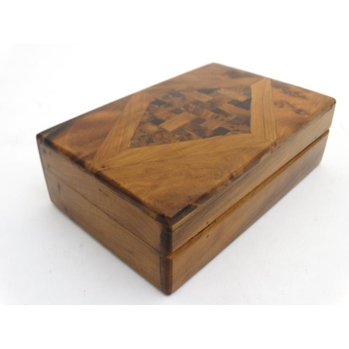 809 - A 20thC walnut cigar box inlaid with diamond pattern and marquetry to top 5'' deep x 7 3/4'' wide x ... 