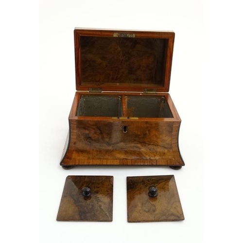 810 - A Victorian burr walnut cross banded concave 2 division tea caddy on squat bun feet.  8 1/4'' wide x... 