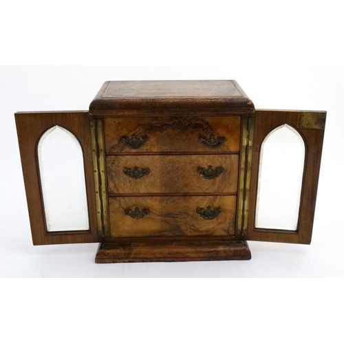 814 - A Victorian burr walnut lancet shaped glazed front table cabinet with 3 graduated drawers 12'' wide ... 