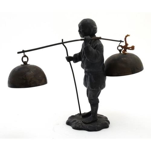 819 - A c.1900 Japanese spelter figure carrying 2 bells. approx 8 1/2'' high