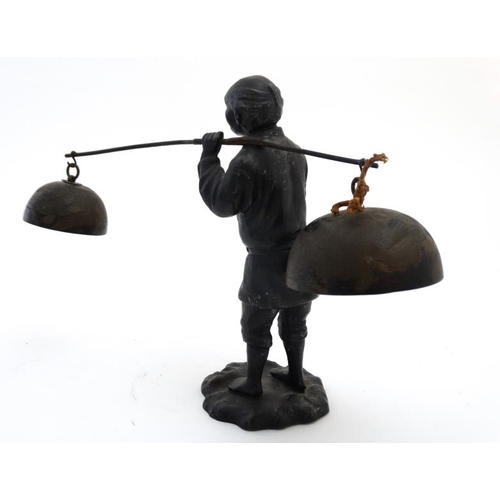 819 - A c.1900 Japanese spelter figure carrying 2 bells. approx 8 1/2'' high