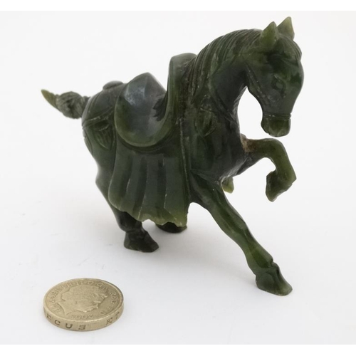 829 - A Chinese spinach green carving of a horse 3 1/8'' high x 4'' long