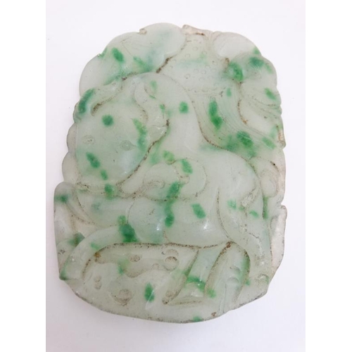 831 - A carved large jade pendant having a Kylin? to one side and a bull to the other. 6 1/2'' x 4 6/8''