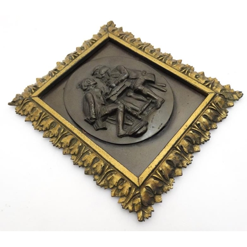 835 - After Teniers, An oval brass relief of card players within a squared acanthus leaf frame 6 1/2'' 5 3... 