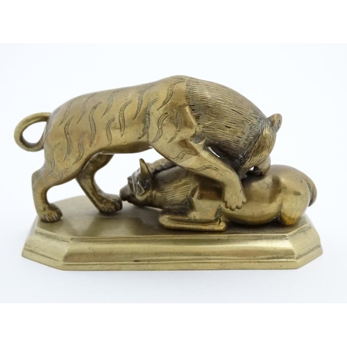 838 - A Chinese cast brass / bronze figure group depicting a tiger and a recumbent water buffalo 4 1/2'' l... 