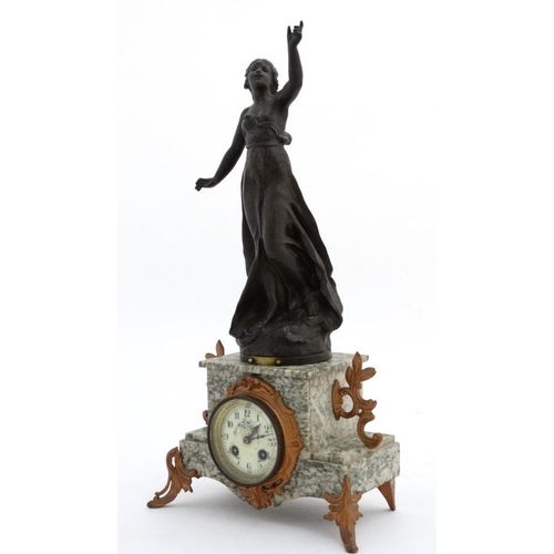 84 - French marble clock : a green flecked marble cased 8 day clock surmounted by a sculpture  after Vict... 