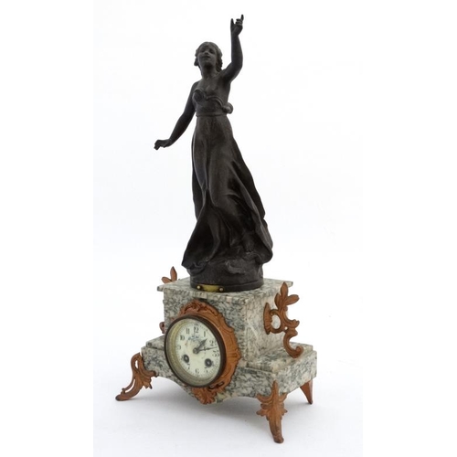 84 - French marble clock : a green flecked marble cased 8 day clock surmounted by a sculpture  after Vict... 