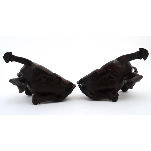 840 - A pair of Chinese carvings formed as children on the backs of water buffaloes on stands , representi... 